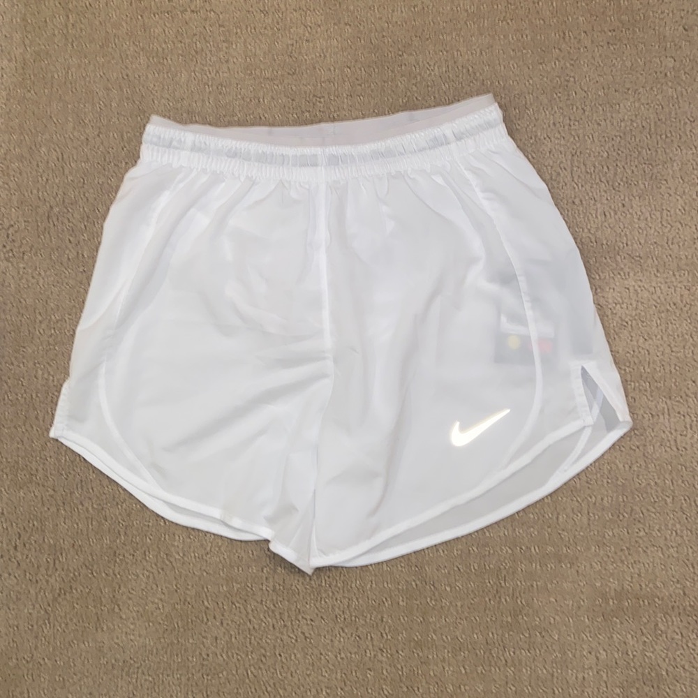 White Nike running shorts